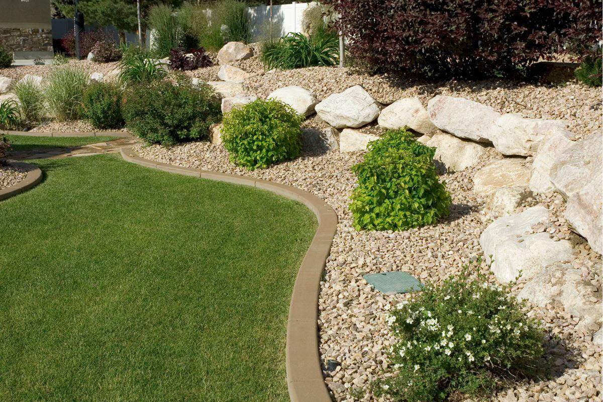 Garden Designed By A Professional Landscaper With Lawn Stone Retaining Walls And Native Plants